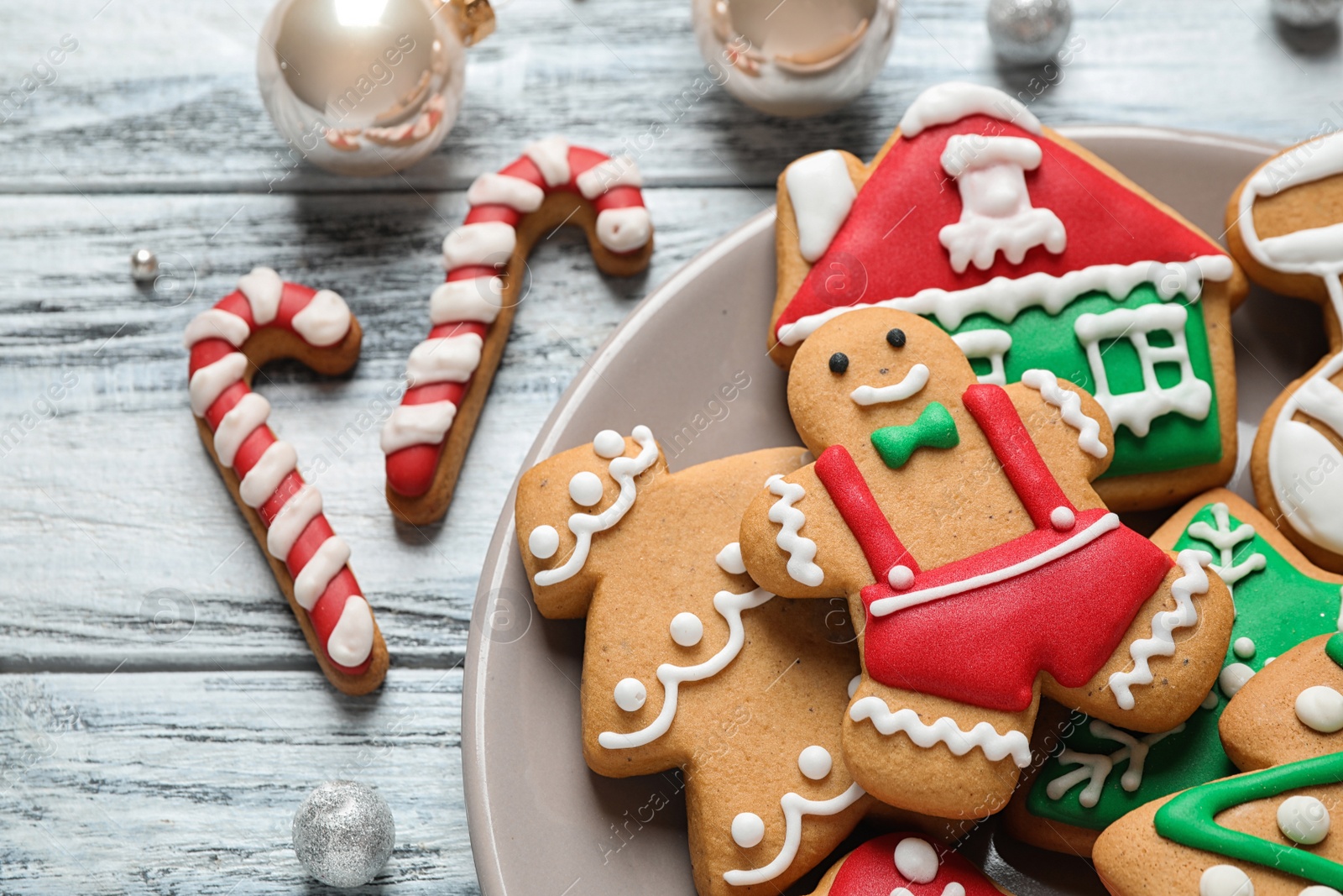 Photo of Tasty homemade Christmas cookies on white wooden table, closeup view