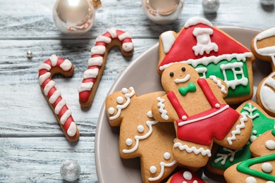 Photo of Tasty homemade Christmas cookies on white wooden table, closeup view