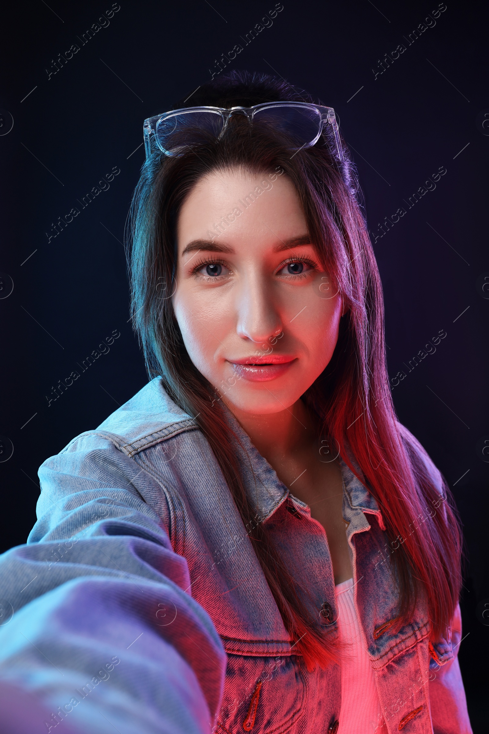 Photo of Portrait of beautiful young woman on color background