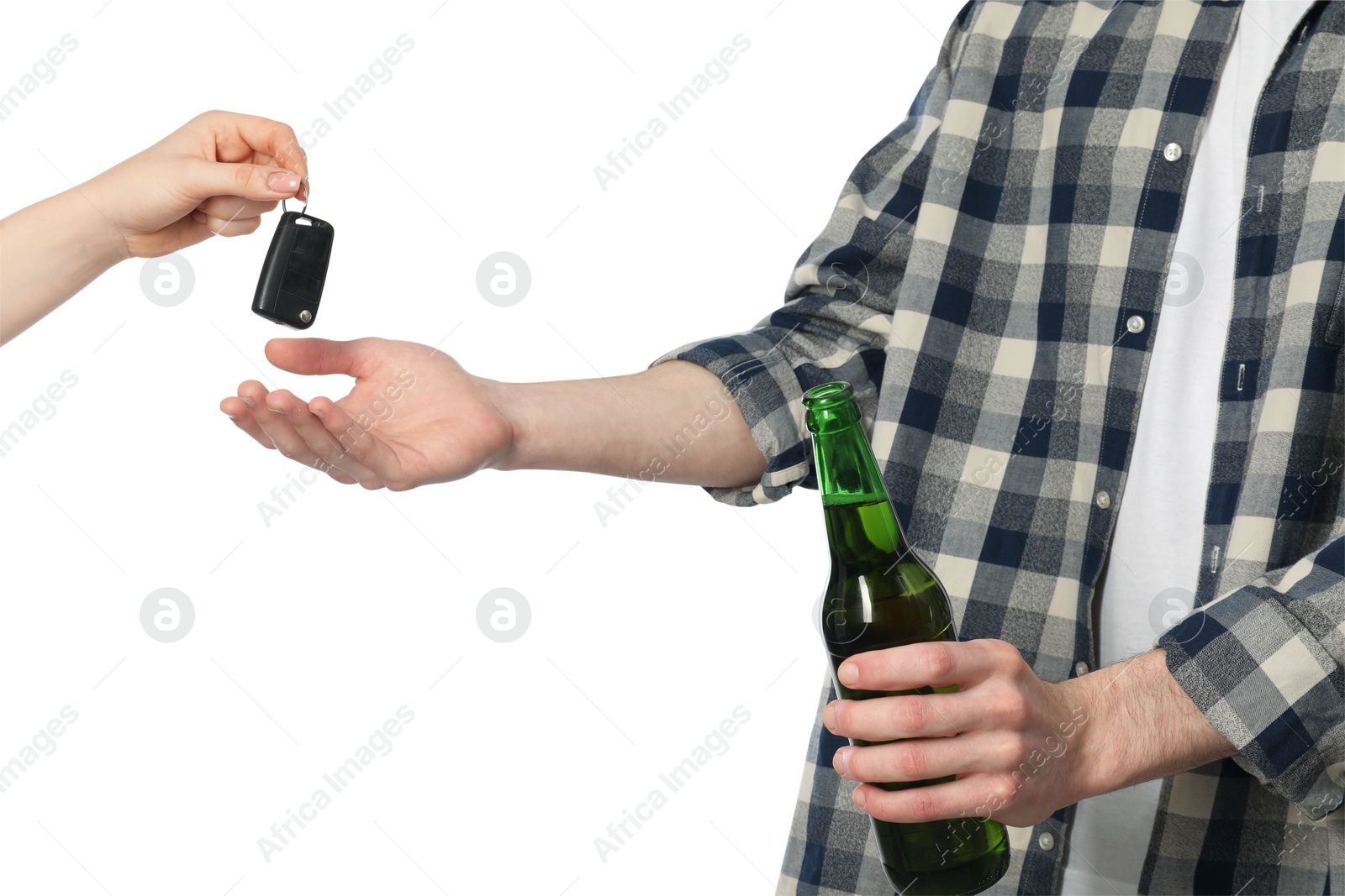 Photo of Woman giving car keys to man with bottle of beer on white background, closeup. Don't drink and drive concept