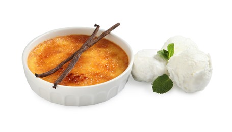 Photo of Delicious creme brulee with vanilla sticks, scoops of ice cream and mint on white background