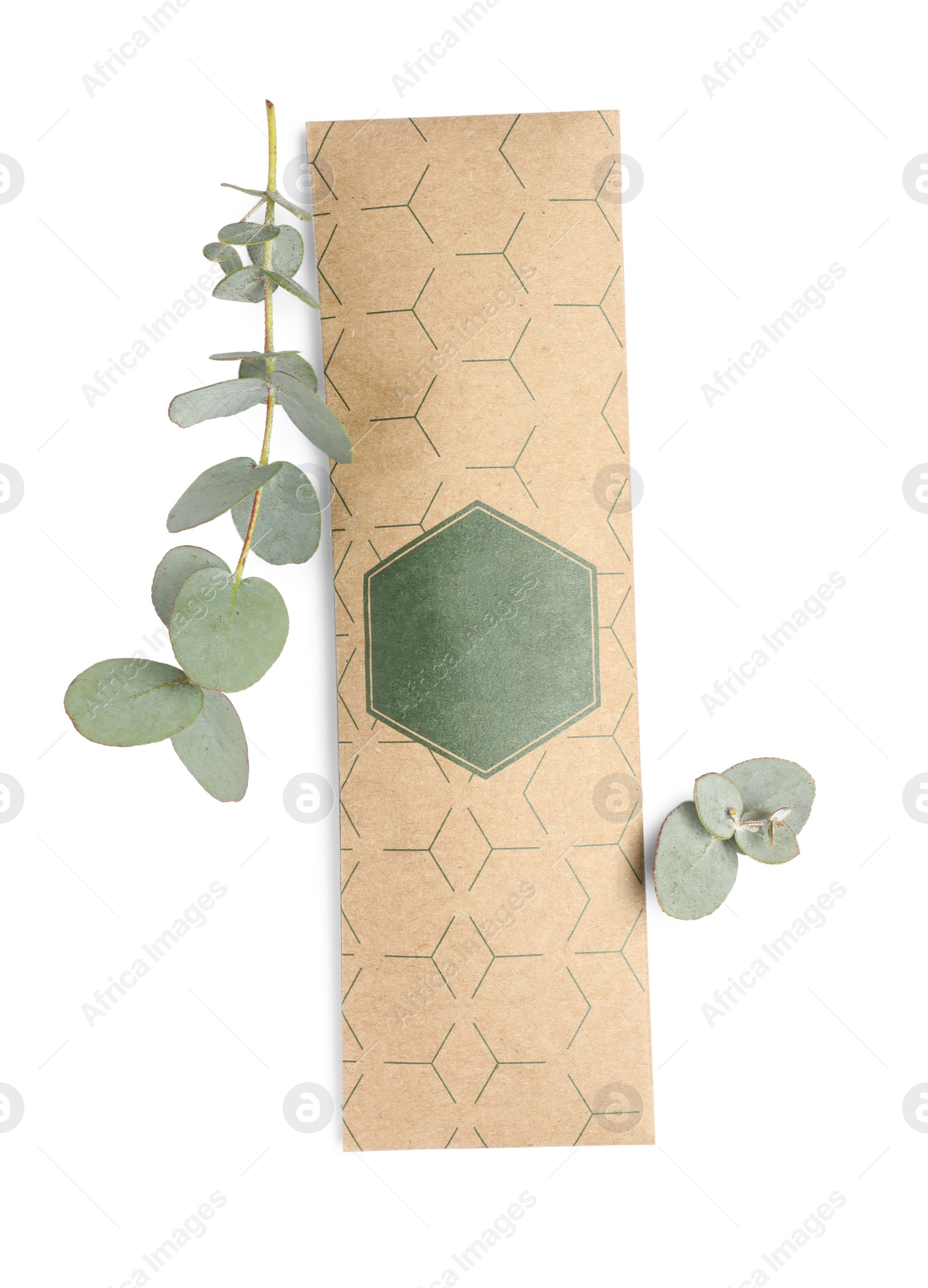 Photo of Scented sachet and eucalyptus branches on white background, top view