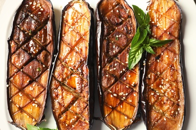 Plate with fried eggplant slices, top view