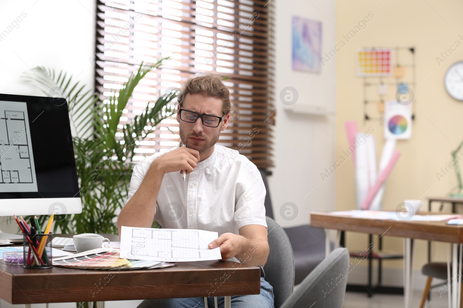 Photo of Professional interior designer at workplace in office