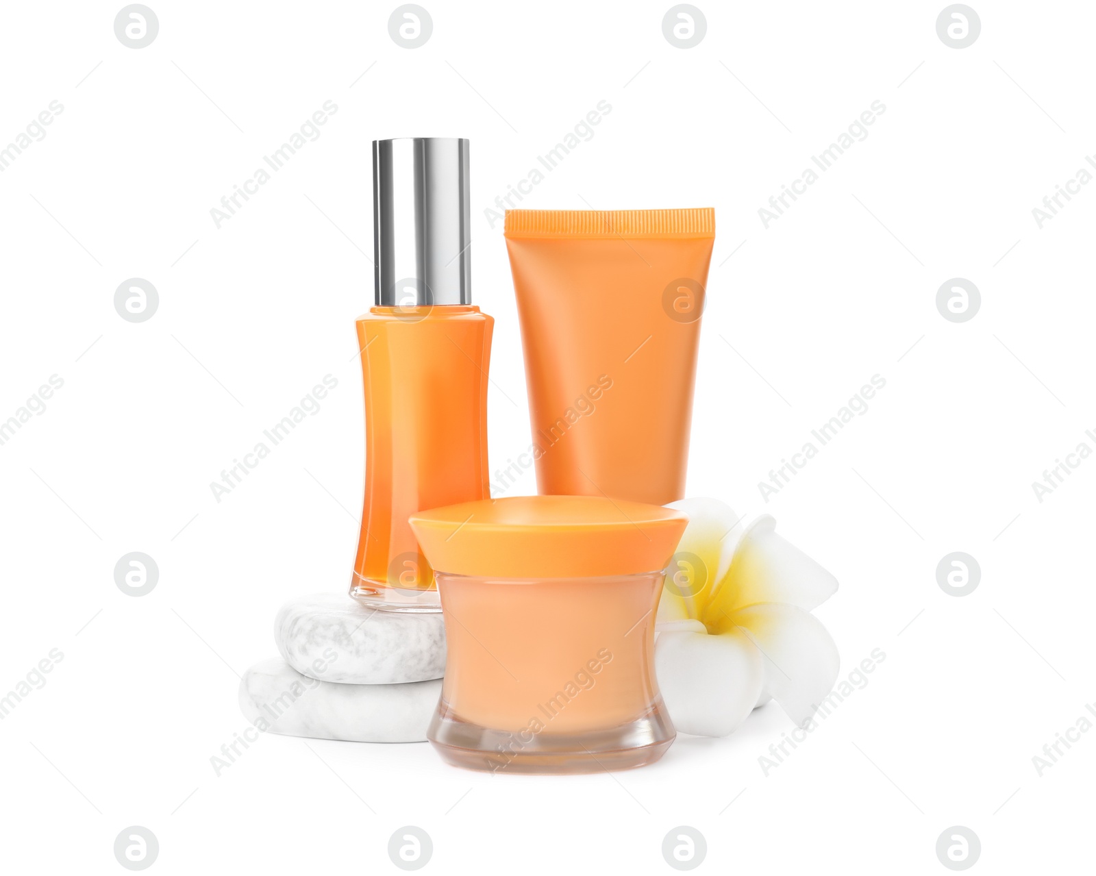 Photo of Cosmetic products, flower and spa stones on white background