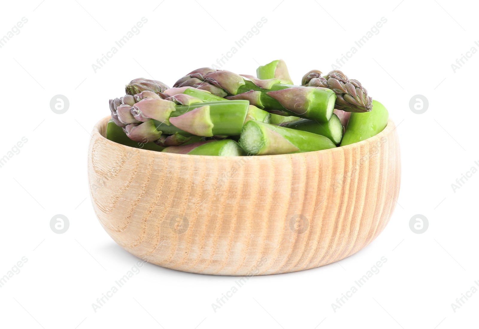 Photo of Raw cut asparagus in wooden bowl isolated on white