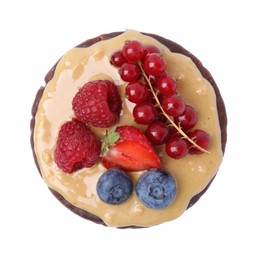 Photo of Crunchy rice cake with peanut butter and sweet berries isolated on white, top view