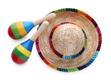 Colorful maracas and sombrero hat isolated on white, top view. Musical instrument