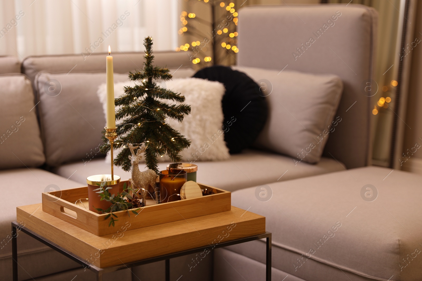 Photo of Composition with decorative Christmas tree and reindeer on wooden tray in living room