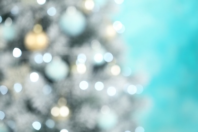 Photo of Beautiful Christmas tree with lights against blue background, blurred view. Space for text