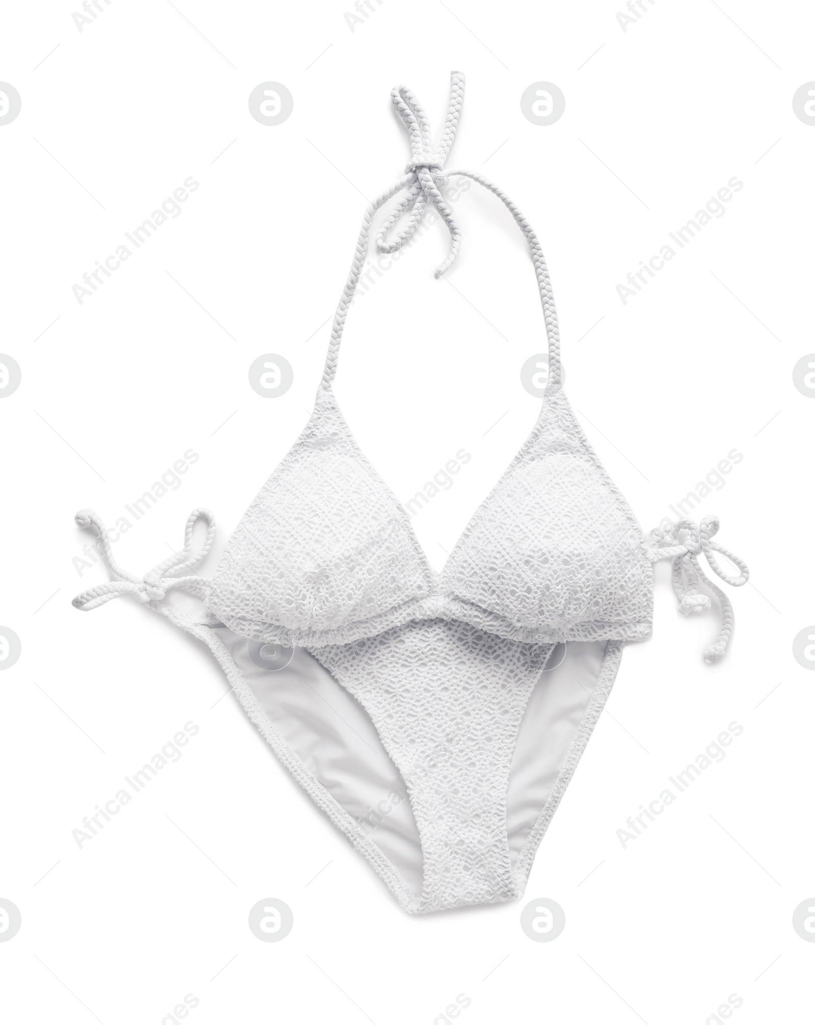 Photo of Swimsuit on white background, top view. Beach accessories