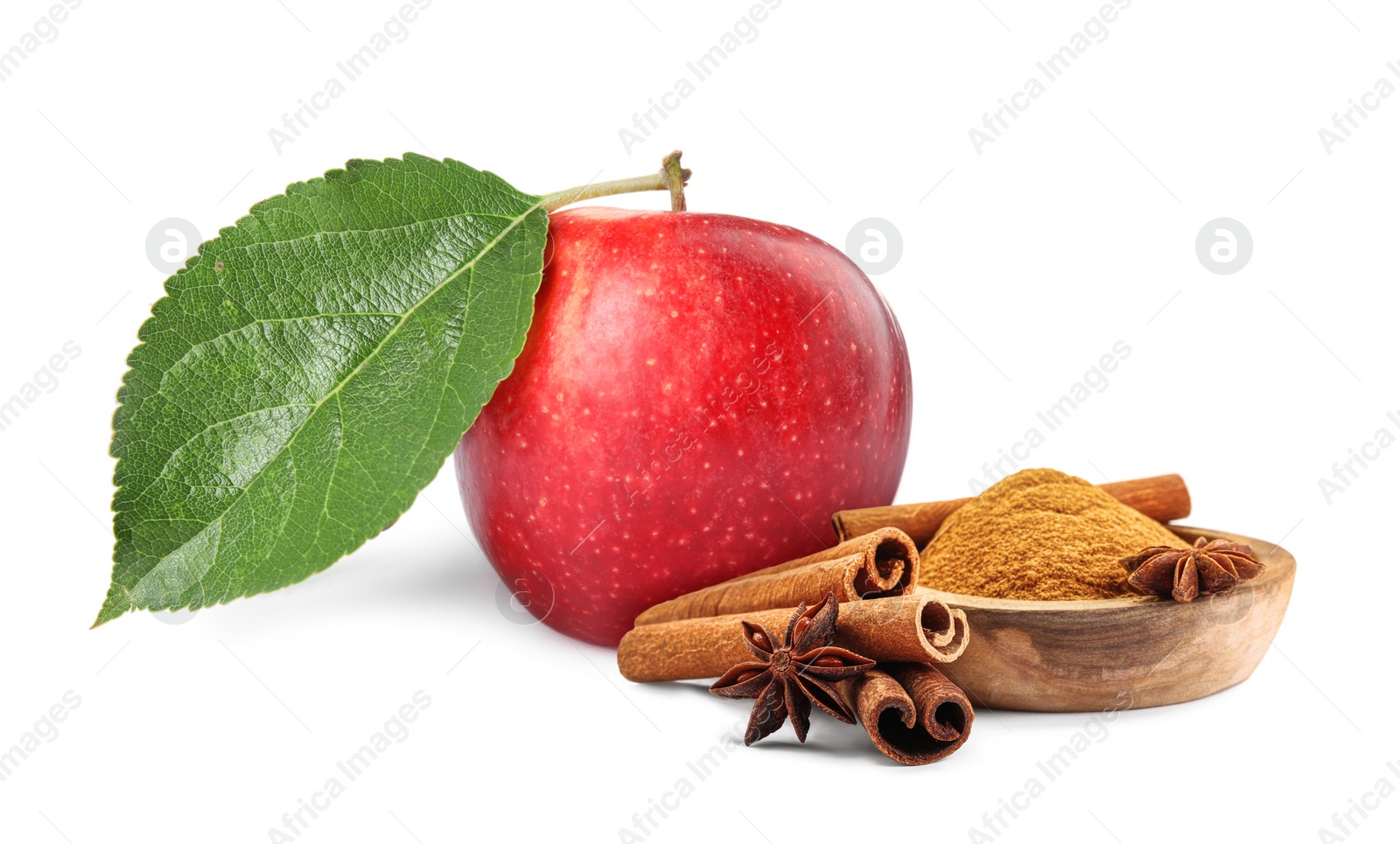 Image of Aromatic cinnamon sticks, powder, anise star and red apple isolated on white