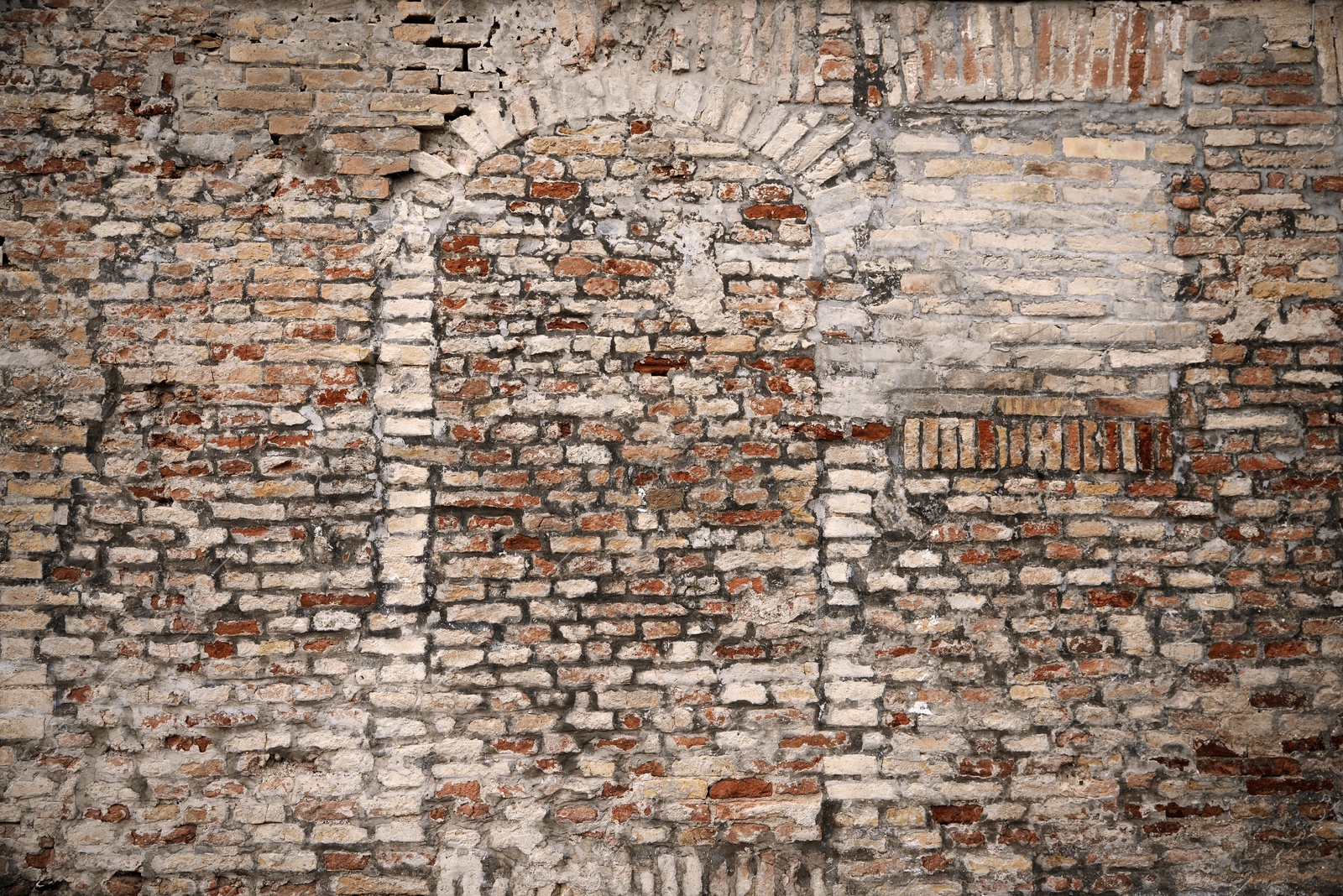 Photo of Old brick wall with blocked doorway as background