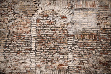 Photo of Old brick wall with blocked doorway as background