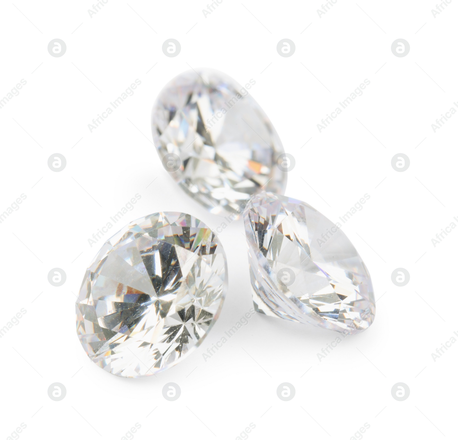 Photo of Three beautiful shiny diamonds isolated on white