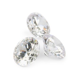 Photo of Three beautiful shiny diamonds isolated on white