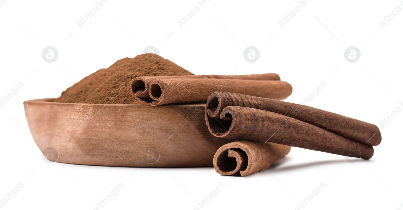 Photo of Dry aromatic cinnamon sticks and powder isolated on white