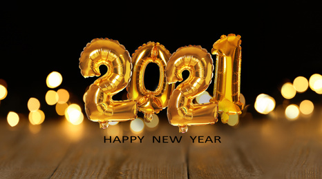 Image of Festive balloons on blurred background, bokeh effect. Happy New Year