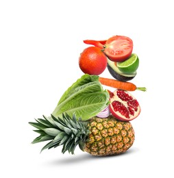 Image of Stack of different vegetables and fruits isolated on white