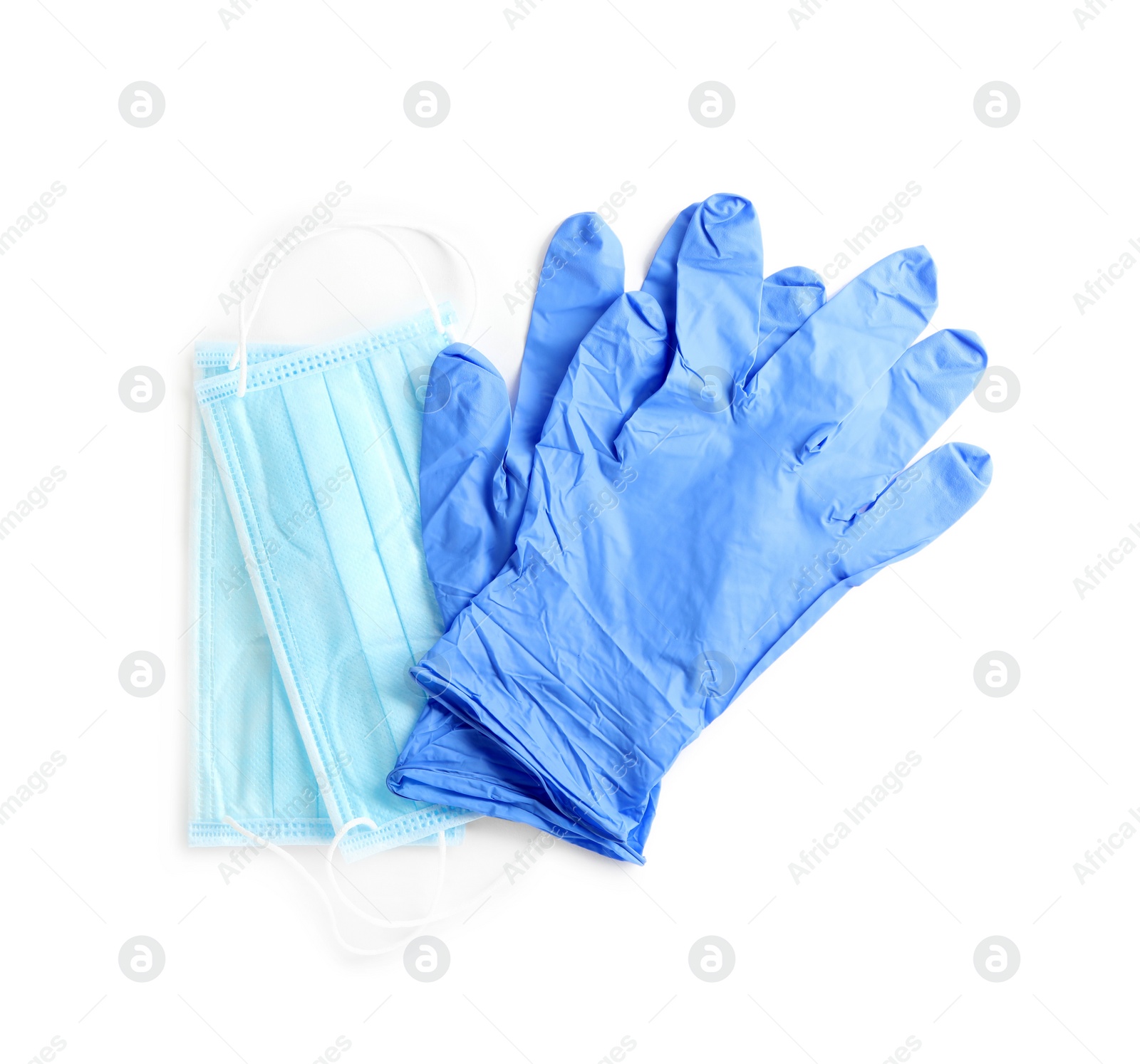 Photo of Medical gloves and protective face masks on white background, top view