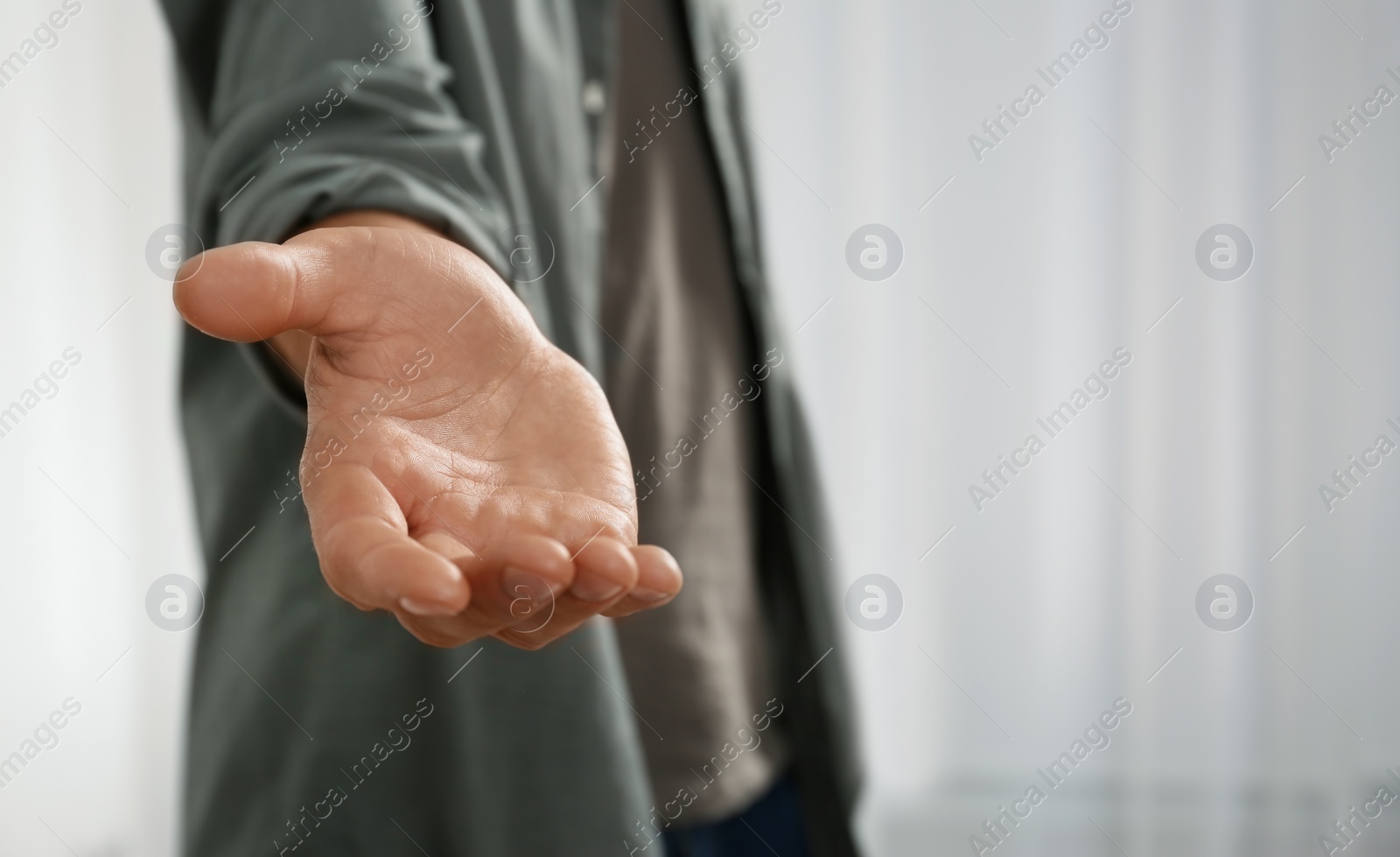 Photo of Man giving hand to somebody, closeup. Help and support concept