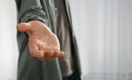 Photo of Man giving hand to somebody, closeup. Help and support concept