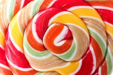 Photo of Tasty colorful fruit flavored candy as background, closeup