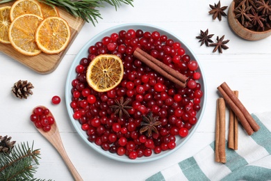Photo of Flat lay composition with fresh ripe cranberries on white wooden table
