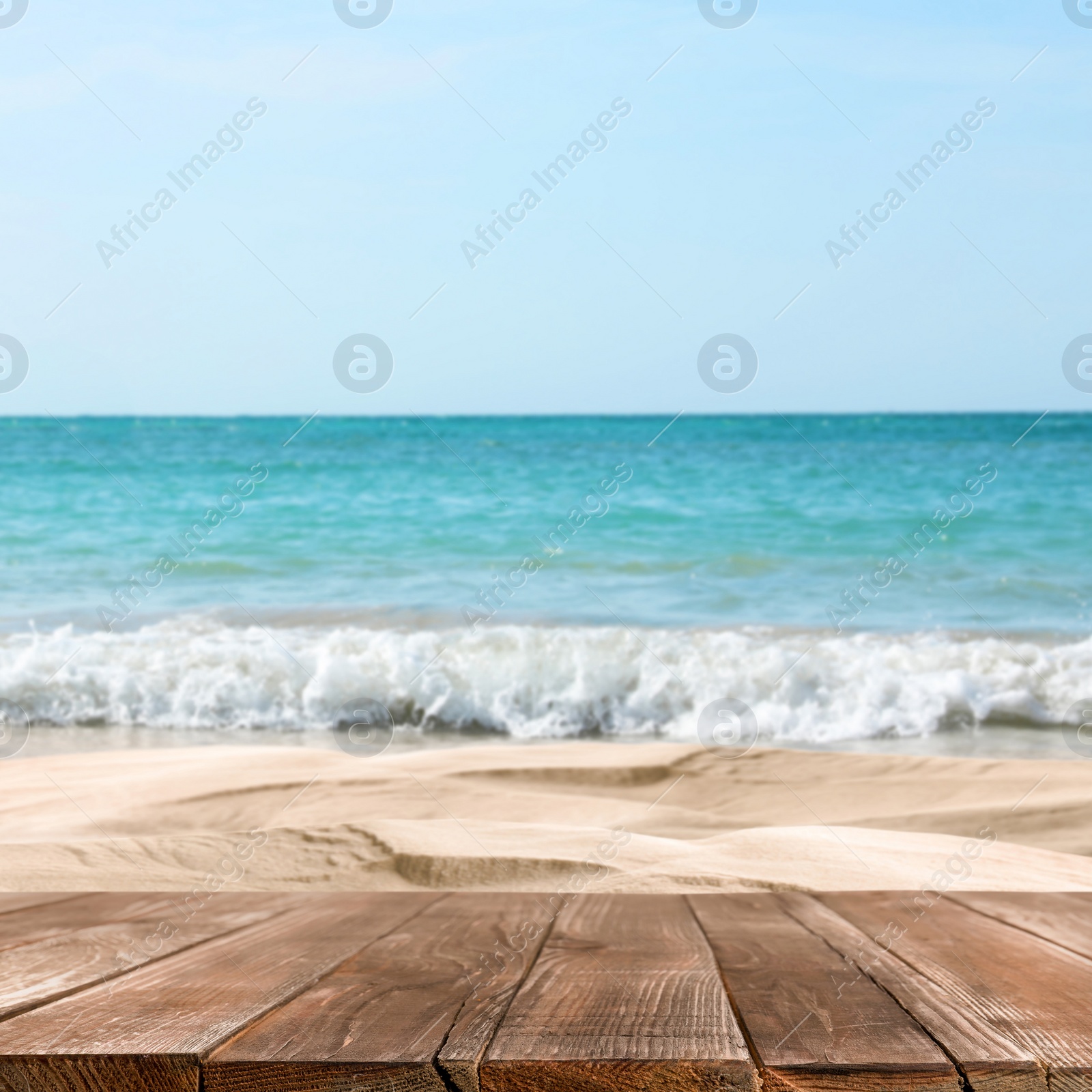 Image of Wooden surface on sandy beach near ocean