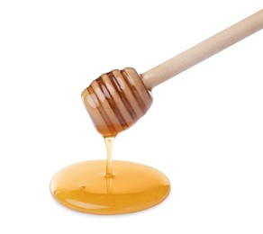 Photo of Honey dripping from dipper on white background