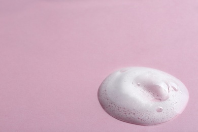 Drop of soap foam on color background. Space for text