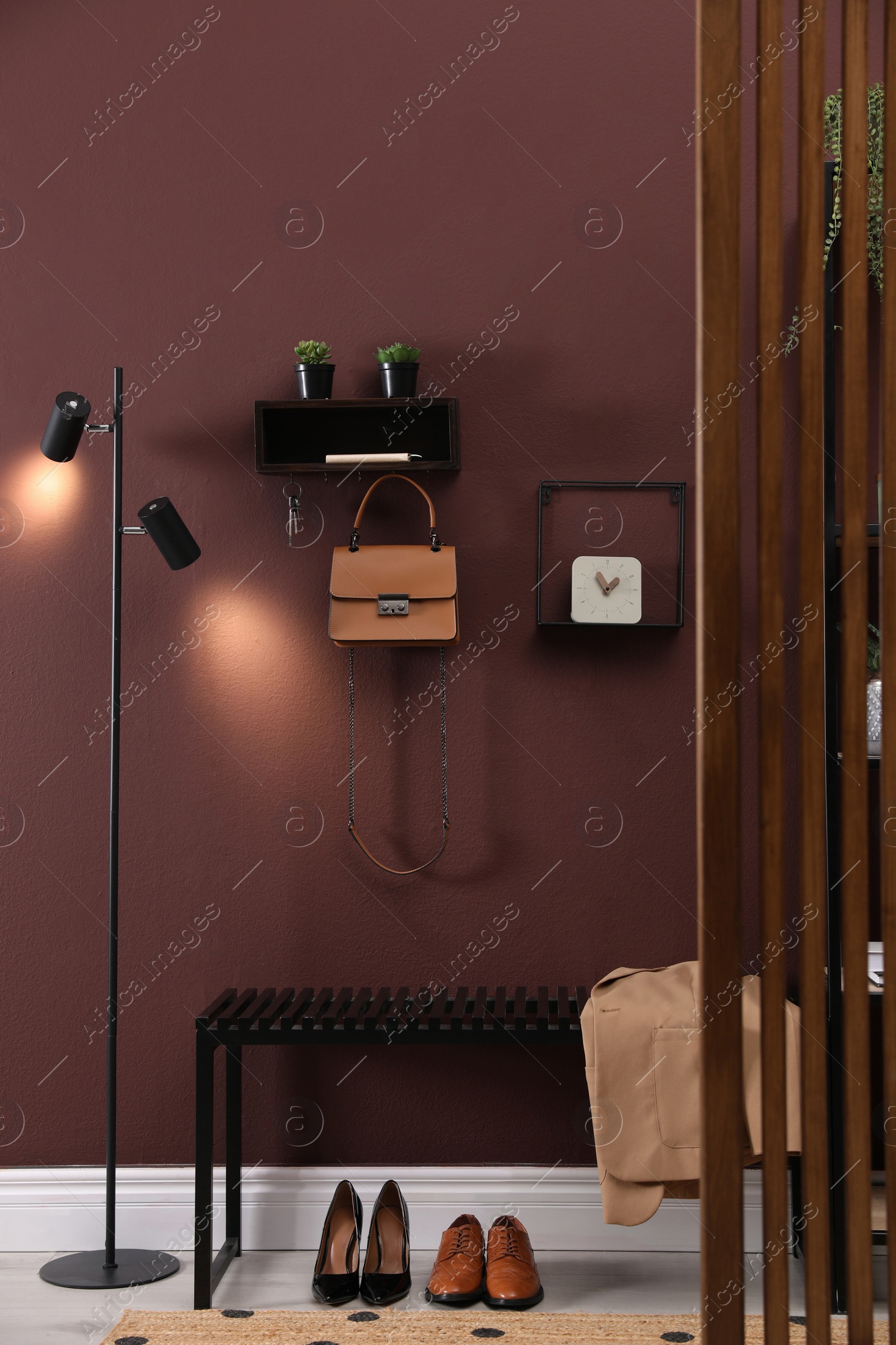 Photo of Modern hallway interior with stylish furniture and key holder