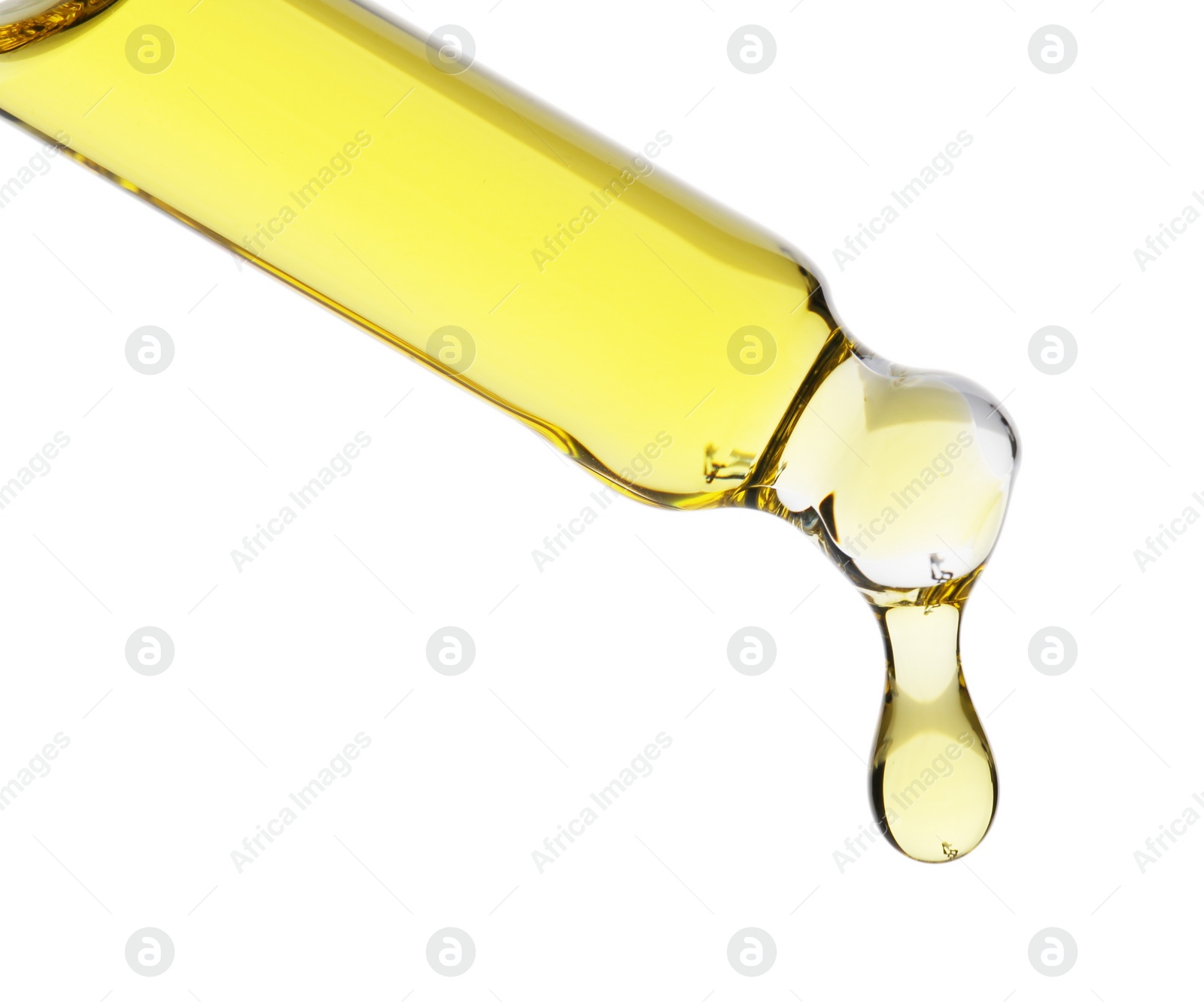 Photo of Dripping tincture from pipette isolated on white