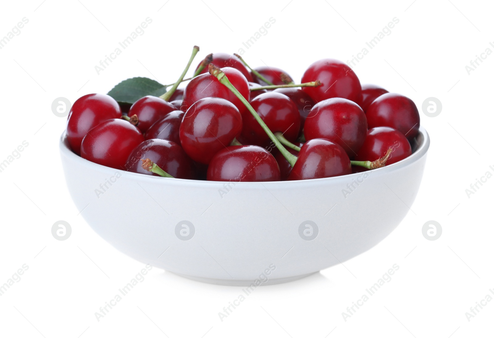 Photo of Sweet juicy cherries in bowl isolated on white