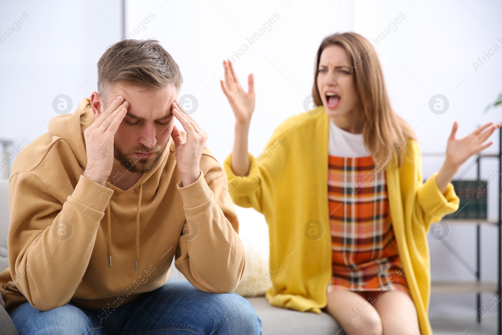 Photo of Couple having quarrel at home. Relationship problems