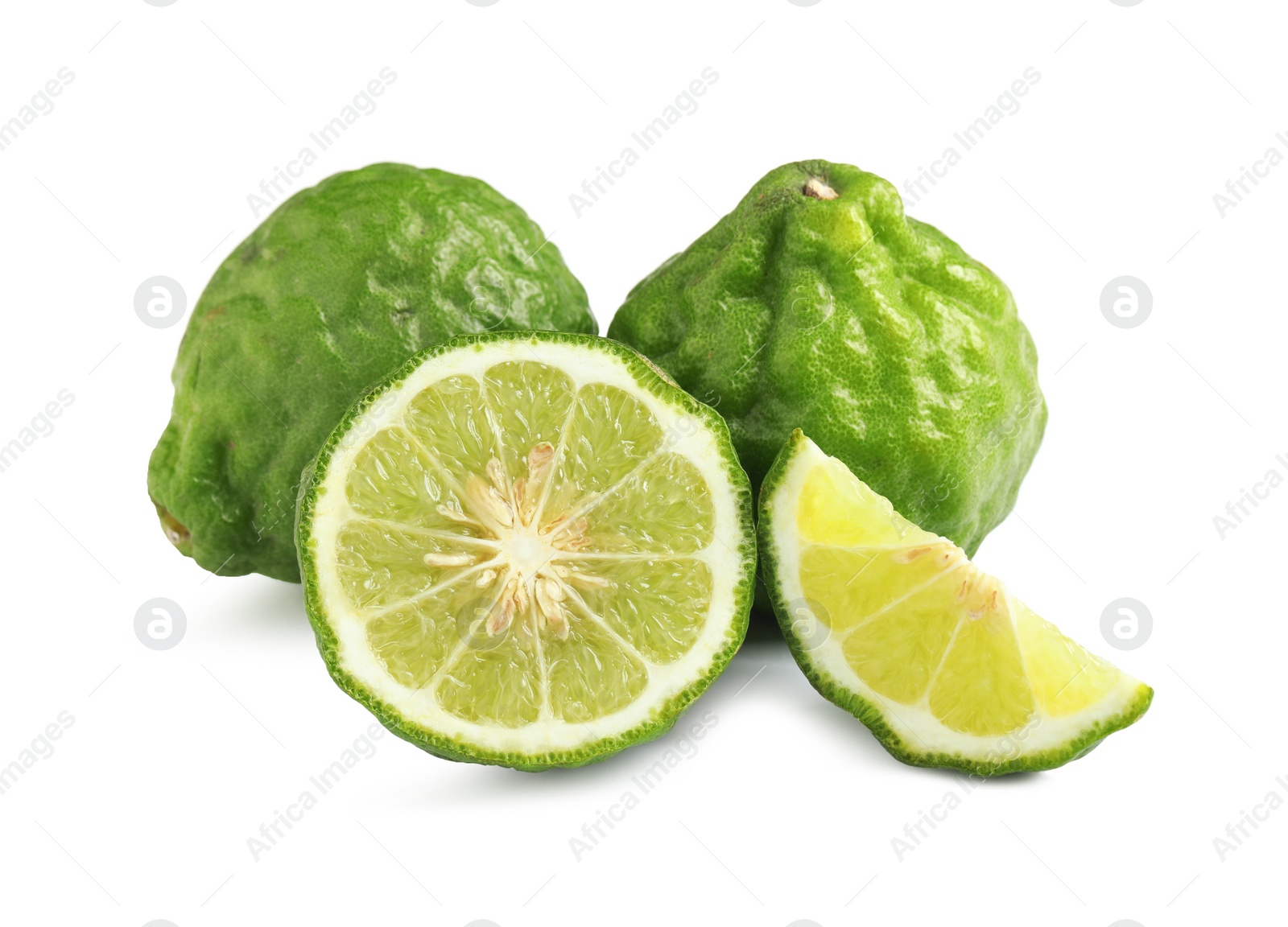 Photo of Whole and cut ripe bergamot fruits on white background