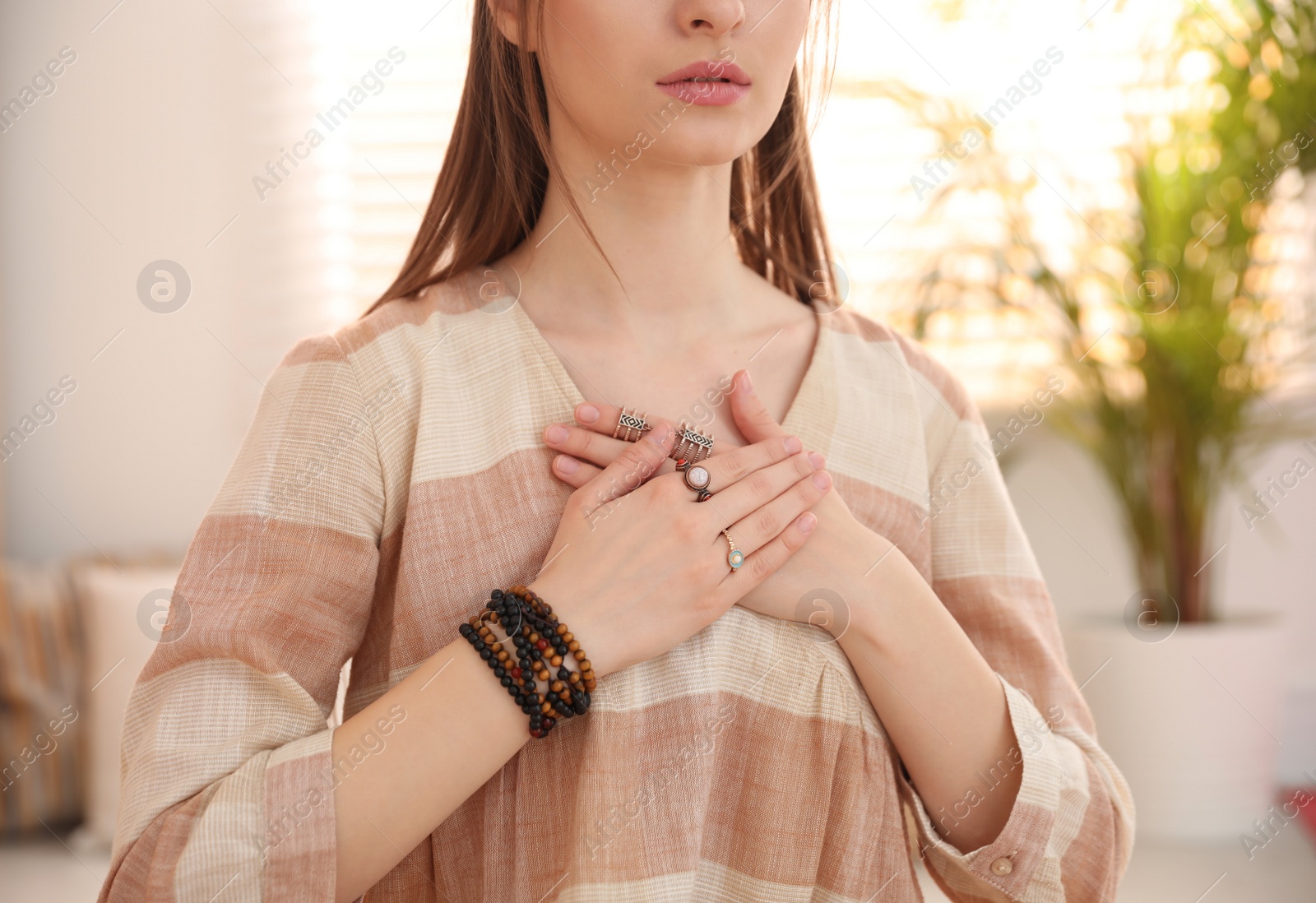 Photo of Young woman during self-healing session in therapy room, closeup