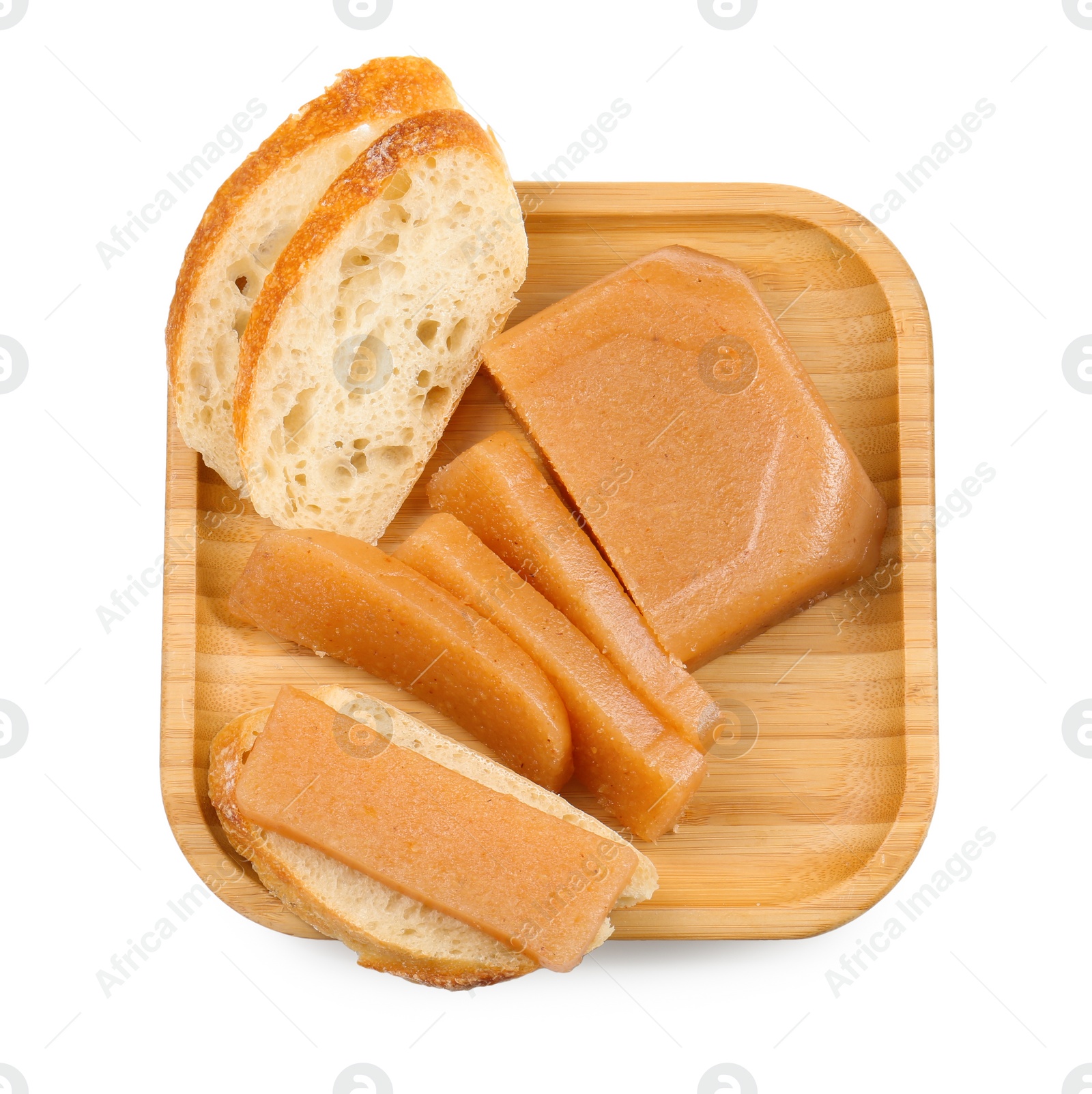 Photo of Delicious sweet quince paste and bread isolated on white, top view