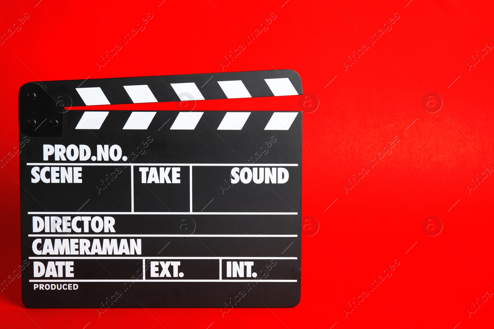 Photo of Clapperboard on color background, space for text. Cinema production