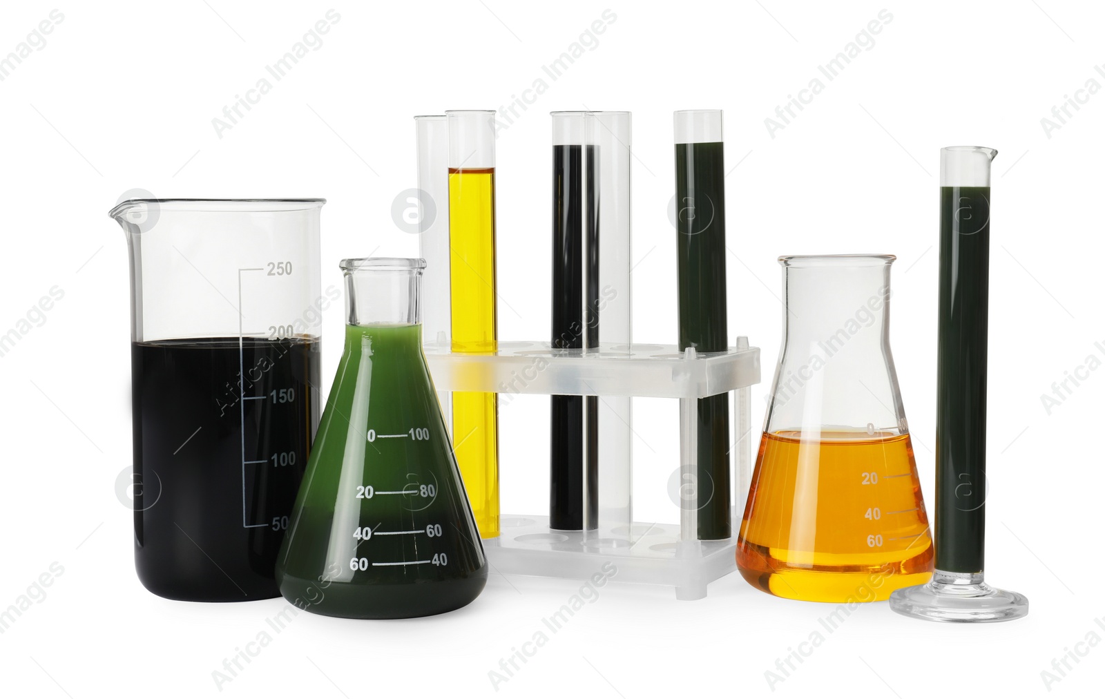 Photo of Laboratory glassware with different types of crude oil isolated on white