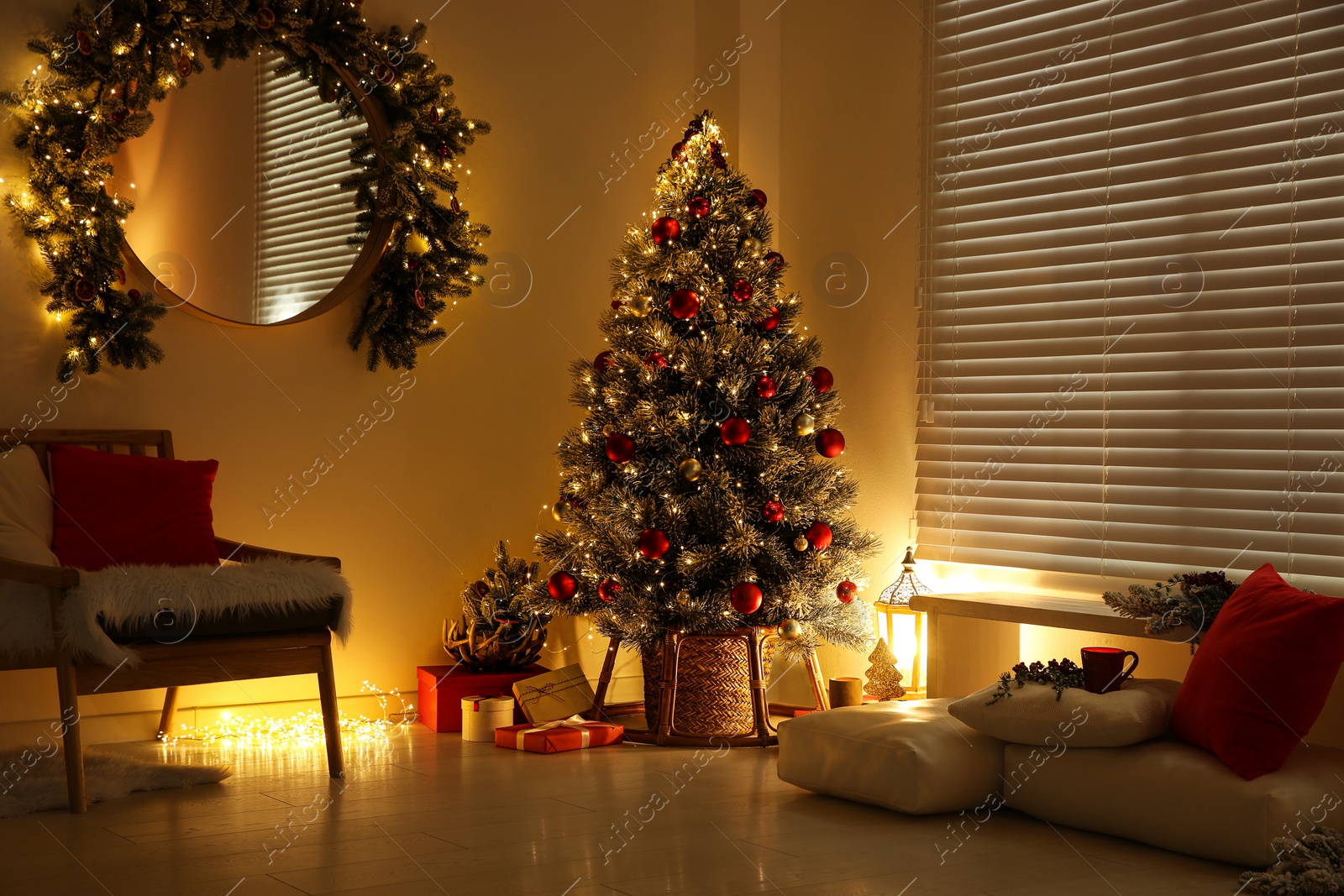 Photo of Beautiful decorated Christmas tree in festive room interior