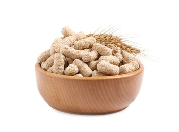 Photo of Granulated wheat bran and spikelets in bowl on white background