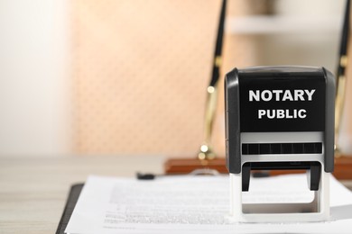 Image of Public notary. Document and stamp on table, closeup. Space for text