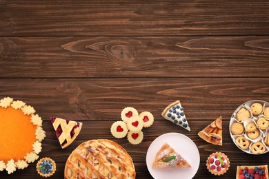 Image of Flat lay composition with different delicious pies on wooden table. Space for text