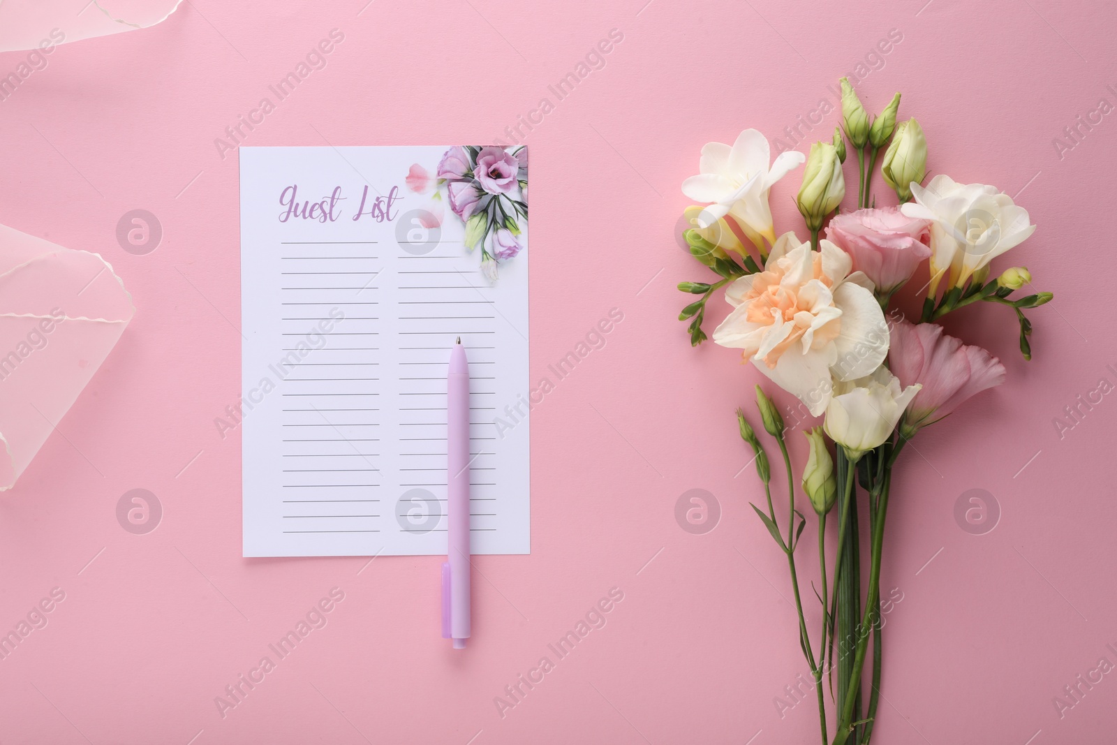 Photo of Guest list, pen and bouquet of beautiful flowers on pink background, flat lay. Space for text