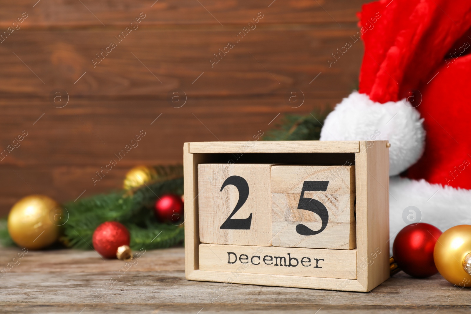 Photo of Wooden block calendar and decor on table. Christmas countdown