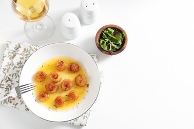 Delicious fried scallops served on white table, flat lay. Space for text