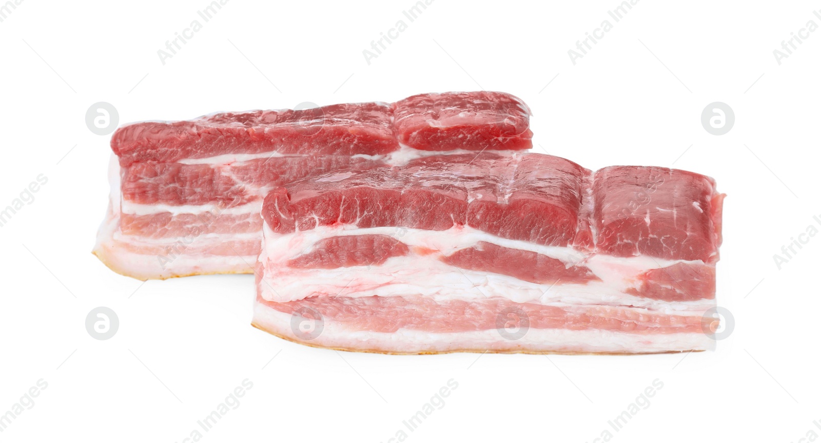 Photo of Pieces of raw pork belly isolated on white