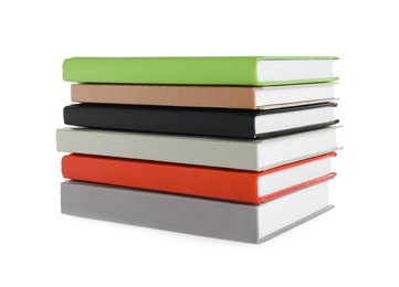 Photo of Stack of different books on white background