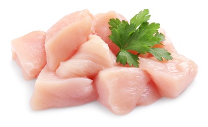 Photo of Cut raw chicken breast with parsley on white background
